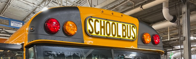 school bus with flat surface roof cap